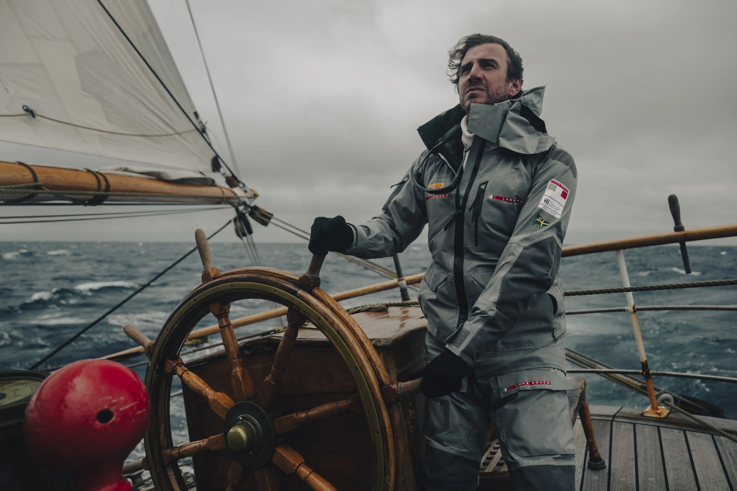 Niccol&ograve; Banfi at the helm of a sailing ship in rough open seas